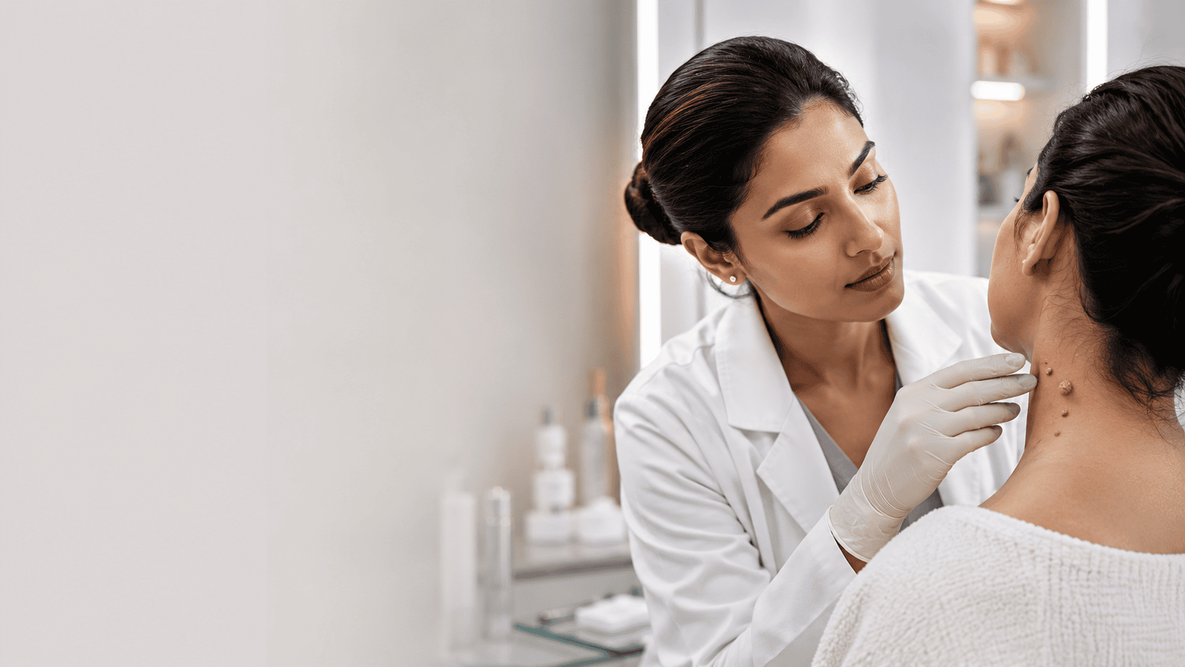 Doctor examining a wart on a patient's neck to assess its type and location